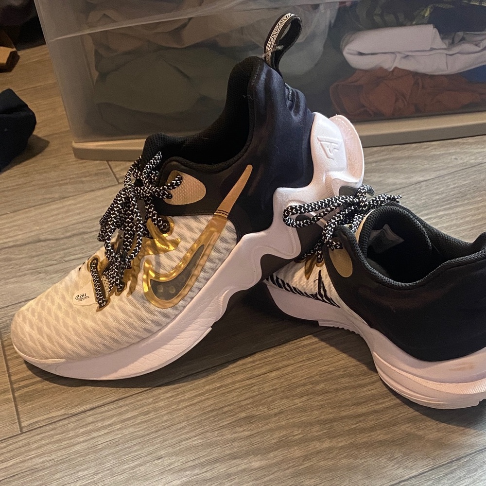 Nike Black and White Sneakers with Gold Swoosh